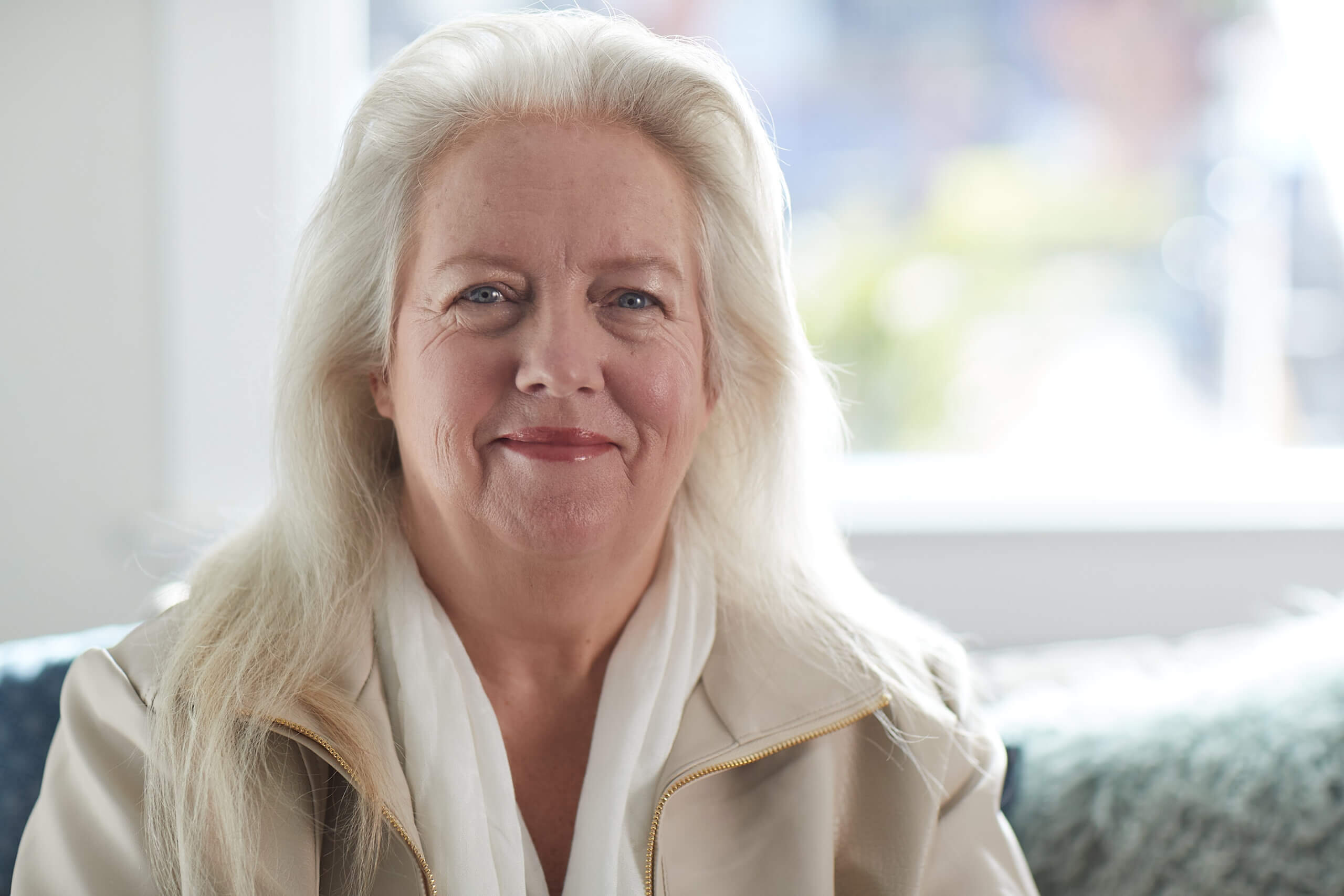 A Medicare Advantage–enrolled senior happily posing