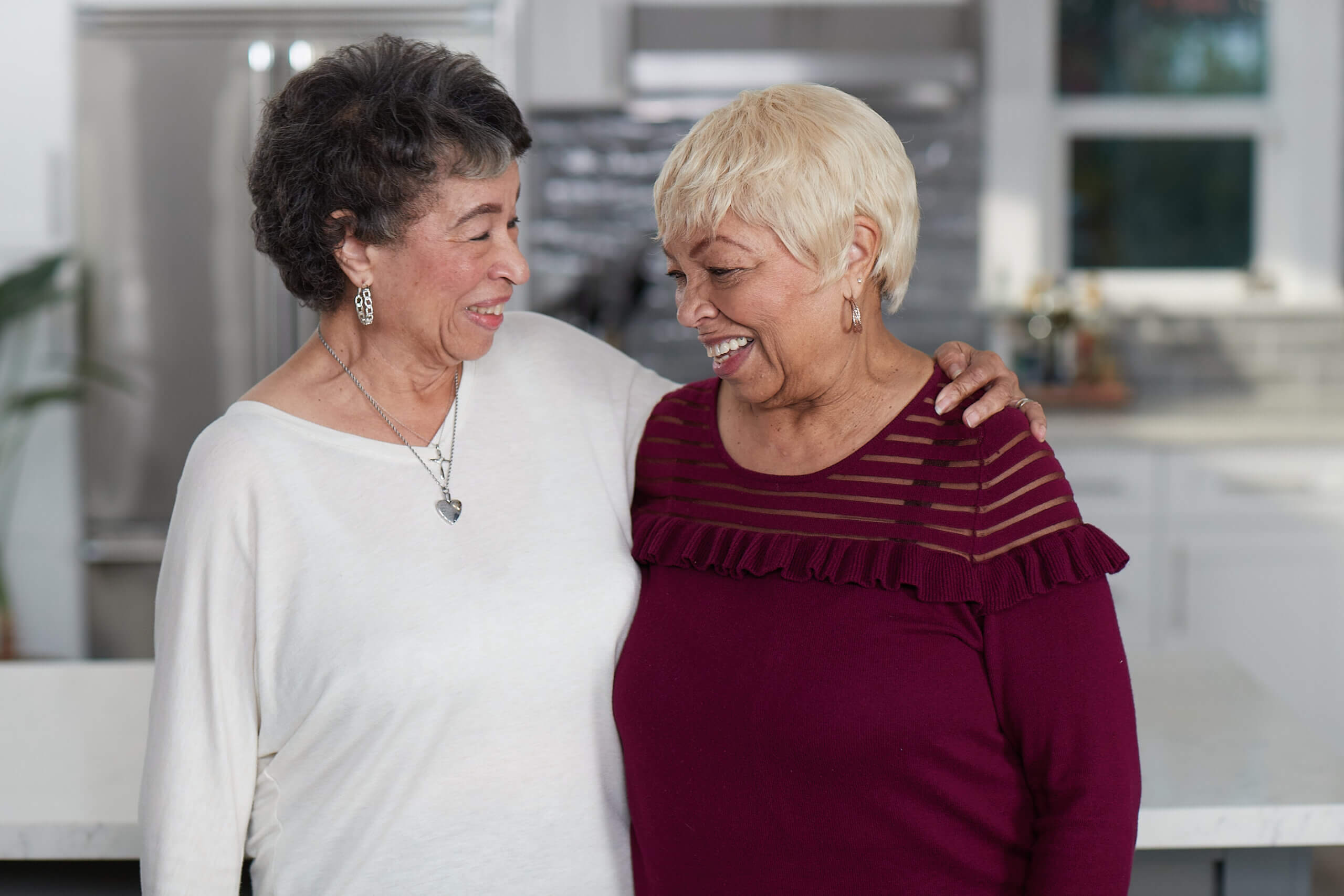 Two Medicare Advantage–enrolled seniors laughing together