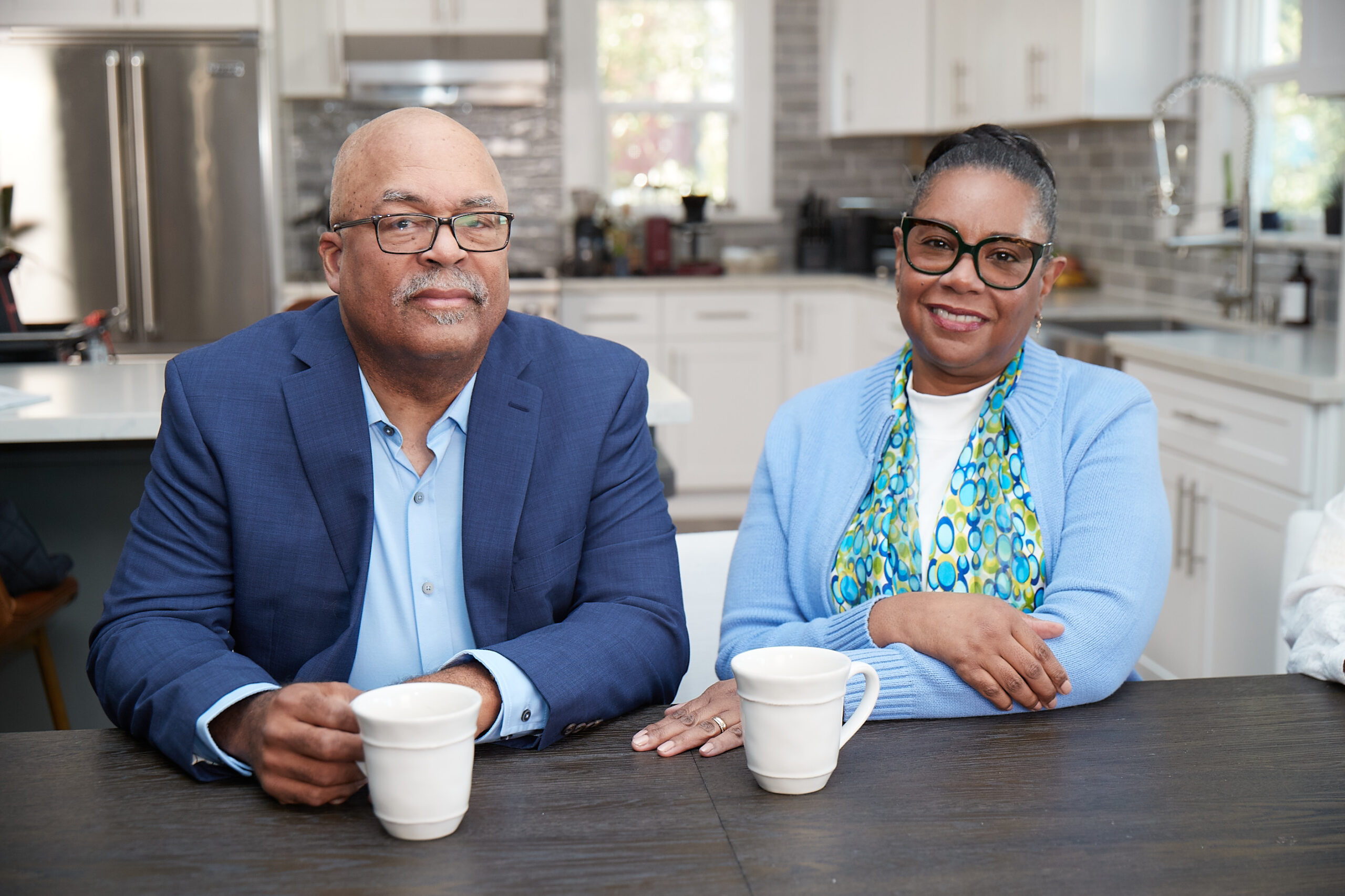 Two Medicare Advantage–enrolled seniors posing with their morning coffee
